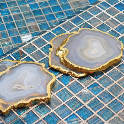 Casa Duniya's Kesseki Agate Coasters Set on a Blue Tiled Background
