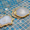 Casa Duniya's Kesseki Agate Coasters Set on a Blue Tiled Background